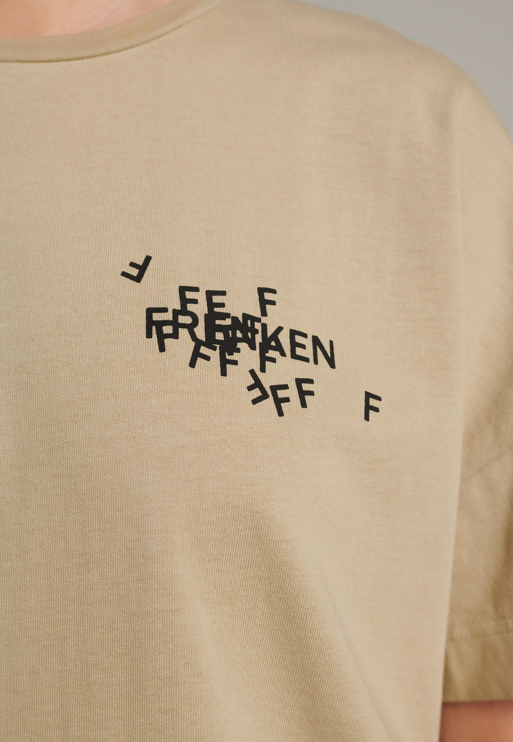 Cut loose fitted  jersey T-Shirt with cracked stamped logo beige