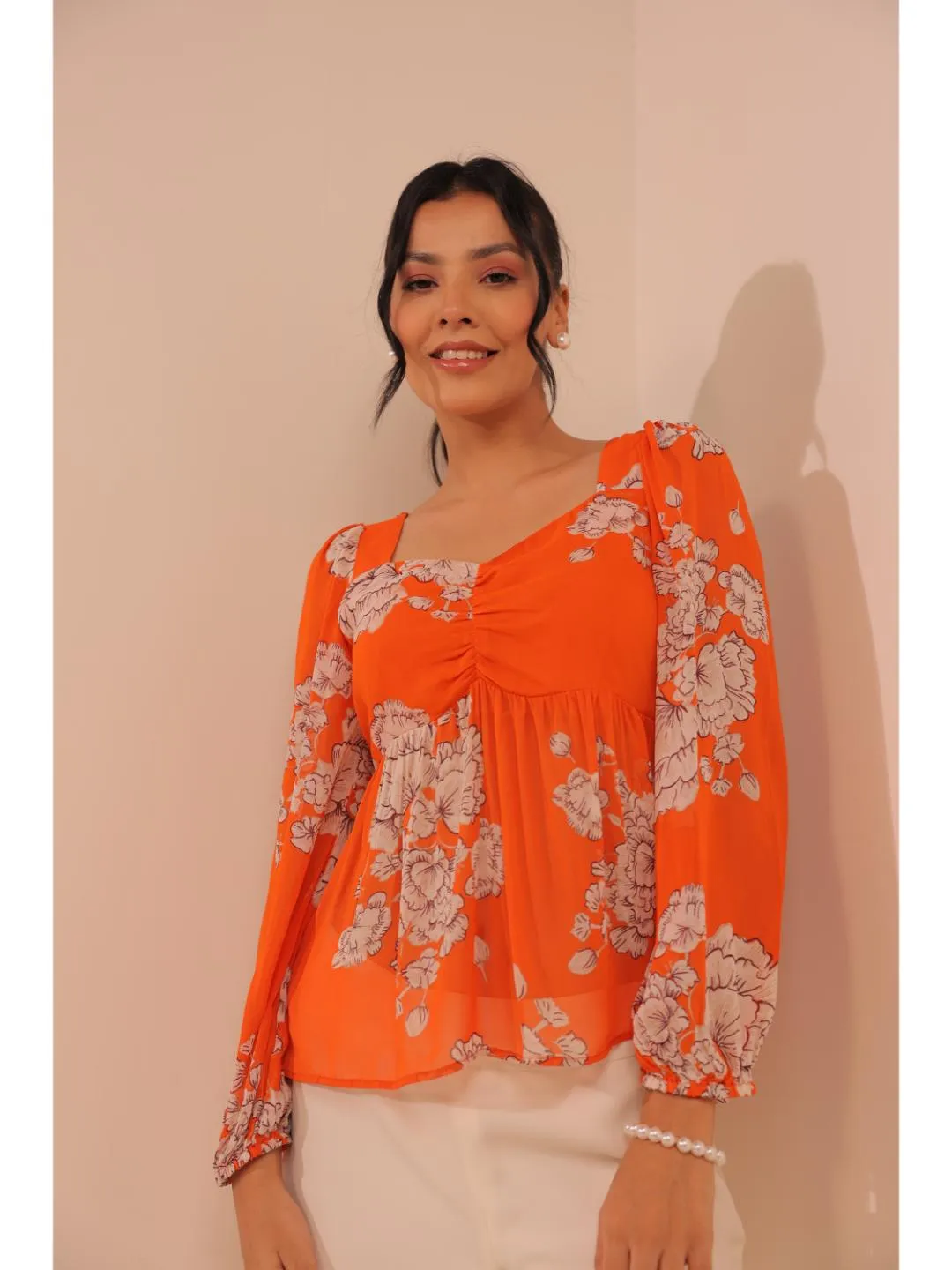 modish viscose georgette floral printed sweet heart center gathered busted, full puff sleeve, back tie-up top. - Orange